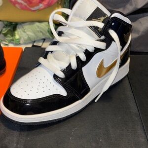 Nike Black and Gold Sneakers with White Accents